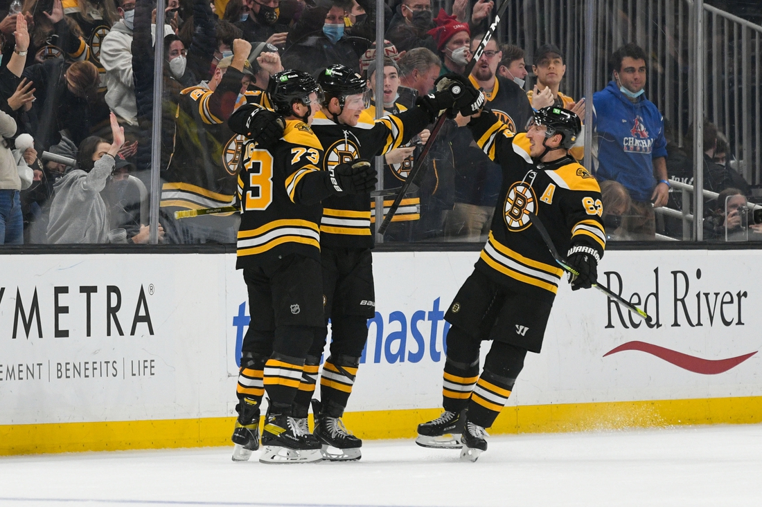 NHL Bruins top Sabres in OT in Boston's first game in over two weeks