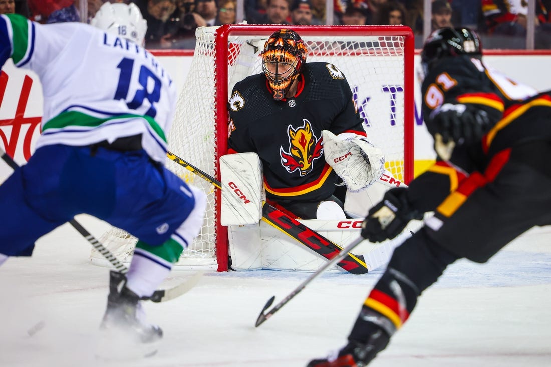 NHL: Elias Lindholm Logs Three Points As Flames Best Canucks